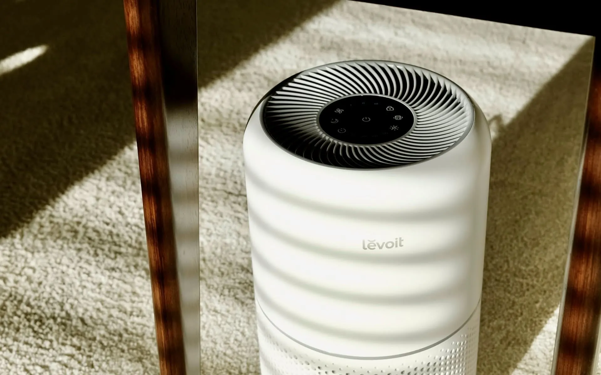 A white cylindrical air purifier on the floor.