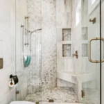 Modern bathroom with marble mosaic tiles shower.