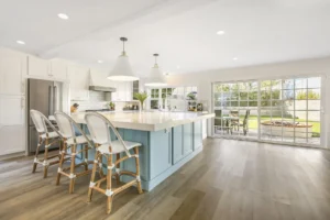 A kitchen island with a white top and blue base.