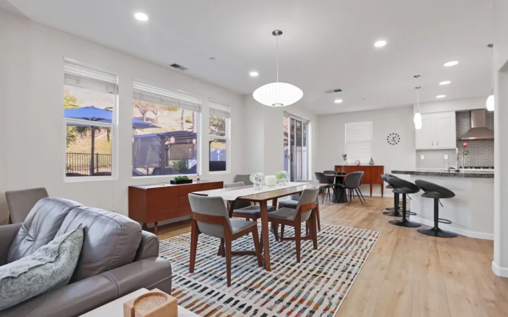 An open living space with a dining table and chairs.