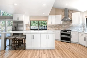 White cabinets and stainless steel appliances in kitchen.