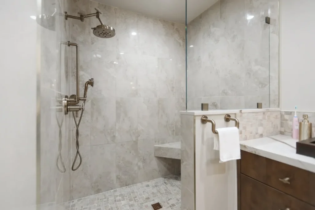 Modern his and her shower with marble tiles.