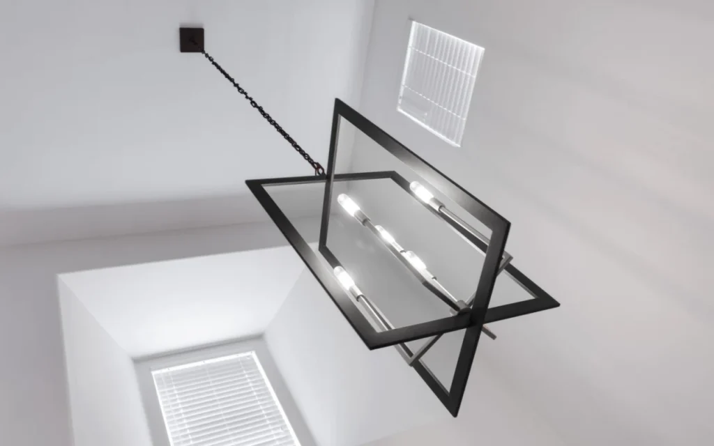 Black metal chandelier hanging from a white ceiling.