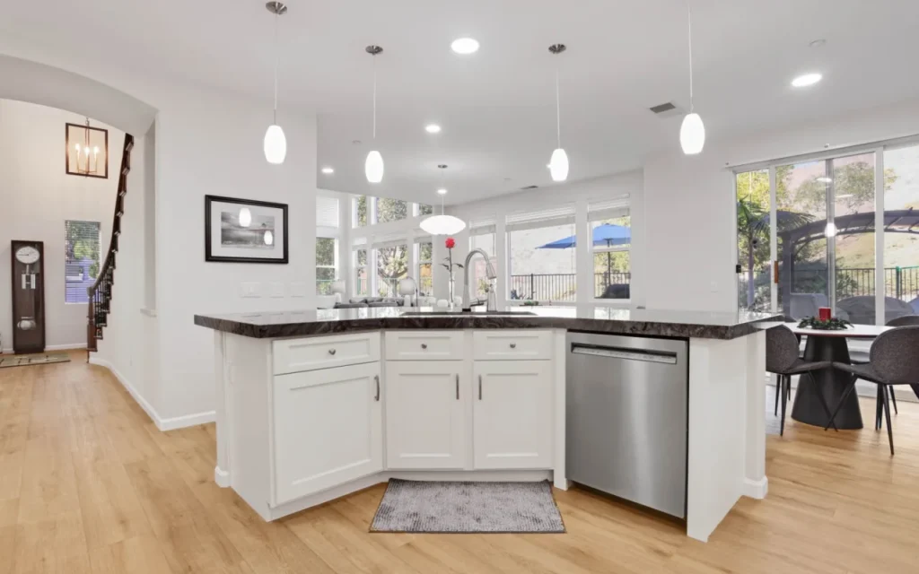 Modern kitchen with stainless steel appliances.