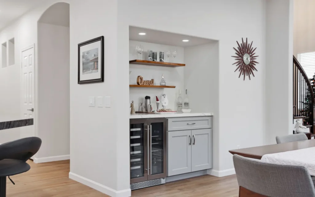 Butler's pantry with wine fridge and storage.