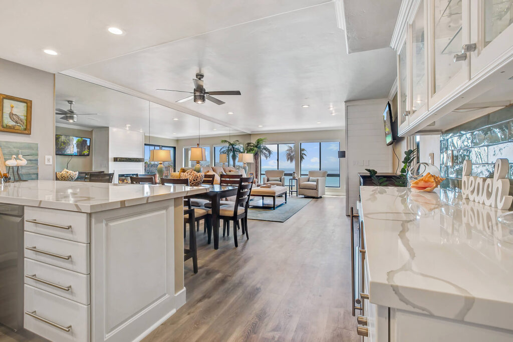 Open concept living room with kitchen and dining area.