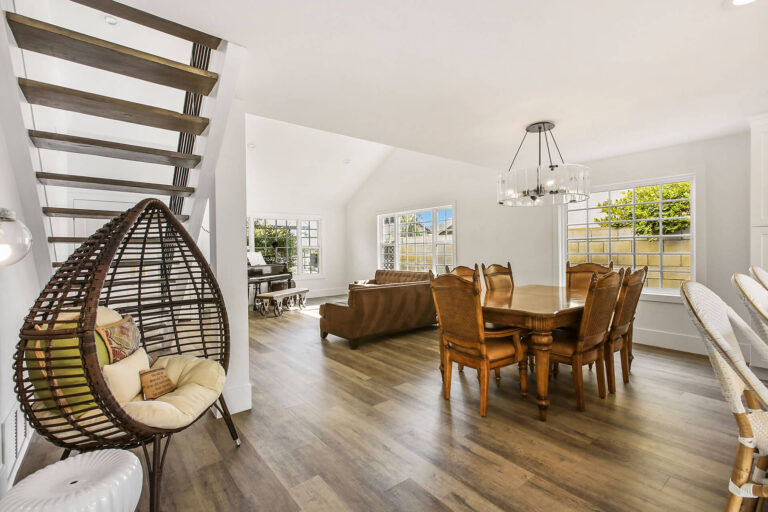 Dining room and living room with hardwood floors.