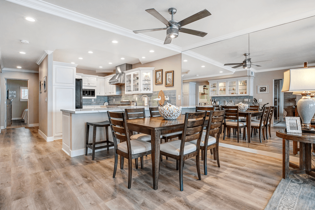 Wood dining table with chairs in a modern kitchen.