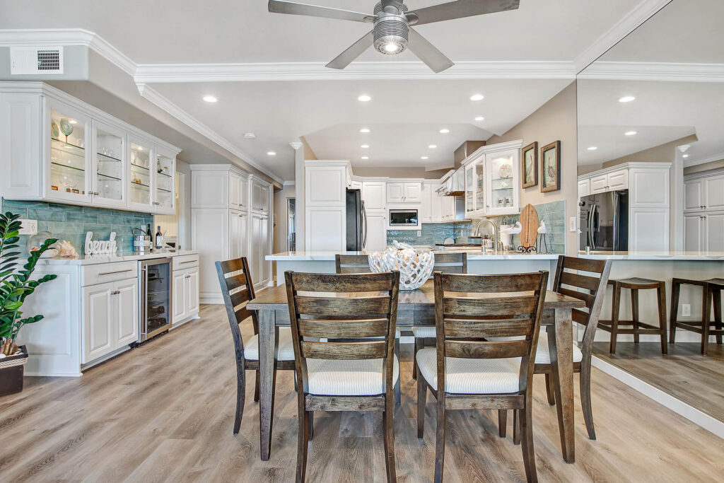 A dining table and chairs in a modern kitchen.