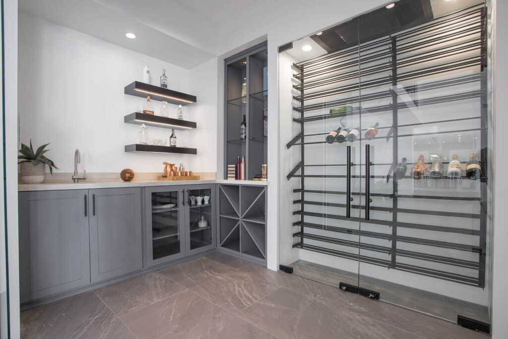 Butler's pantry with marble counter and wine rack.
