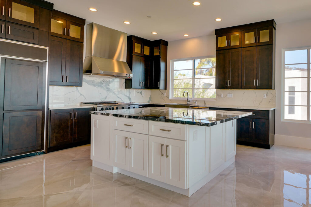 Large modern kitchen with dark cabinets and island.