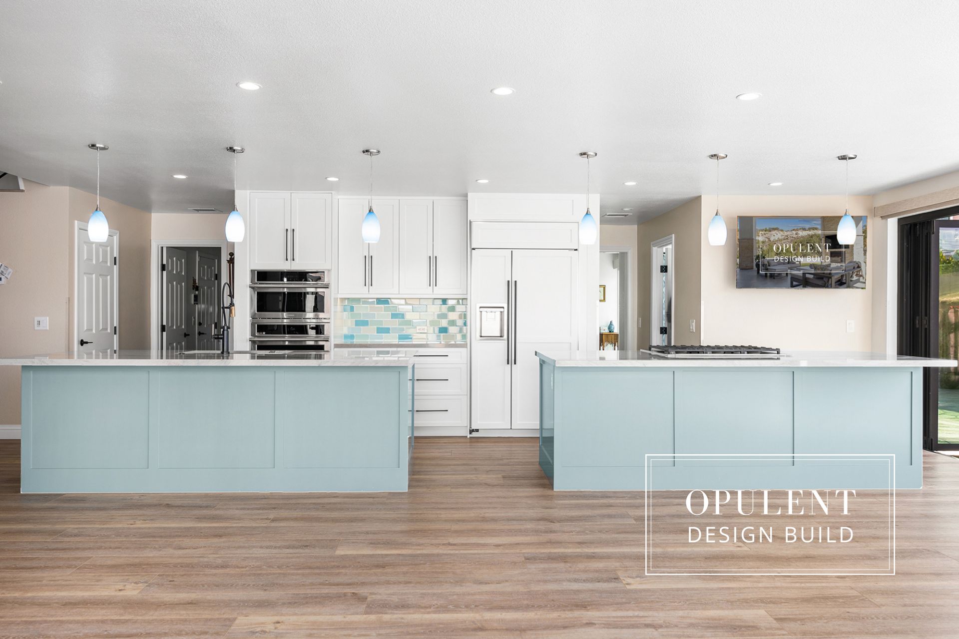 Modern kitchen with light blue cabinets.